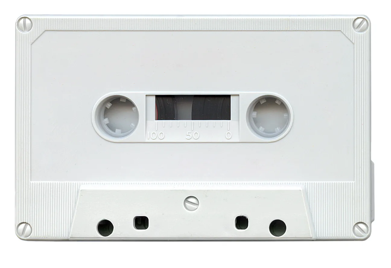 An unlabelled compact audio cassette on a white background