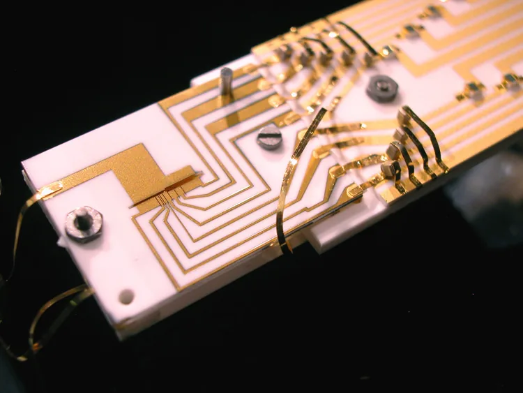 Gold electrodes and wiring around a NIST experimental ion trap used for quantum information processing
